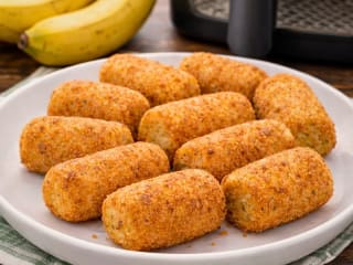 Imagem ilustrativa da receita BANANA EMPANADA NA AIRFRYER FÁCIL E CROCANTE
